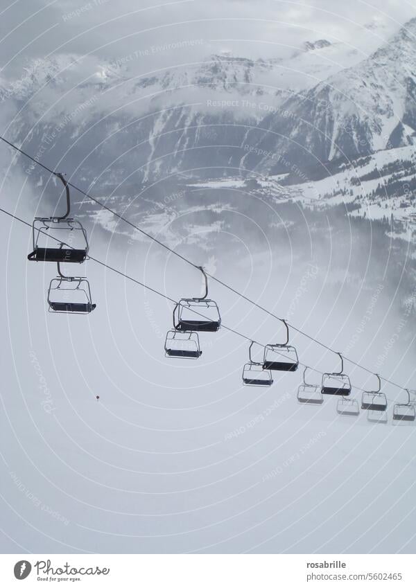 Chairlift in the fog chair lift Winter Snow Skiing Empty Lonely forsake sb./sth. standstill Cold inhospitably Vacancy silent Bad weather foggy Fog chill Frost