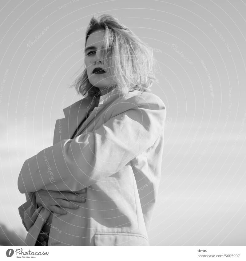 Woman with folded arms in front of the sky portrait Blonde Long-haired Jacket crossed arms Sky Lipstick Looking into the camera Shadow Hand Protection sunny