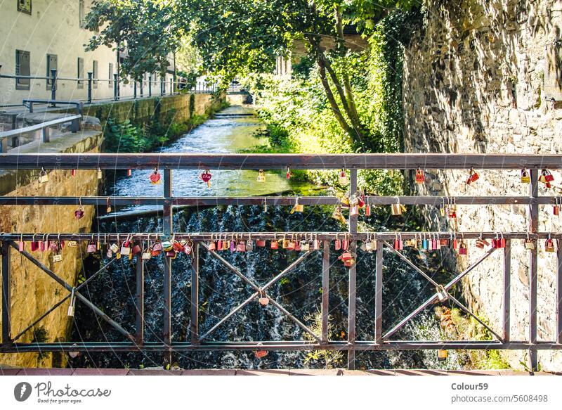 Locks on bridge railings relationship tradition love locks sign safety lovers object tourism symbol padlock old concept metal outdoors romance red heart steel