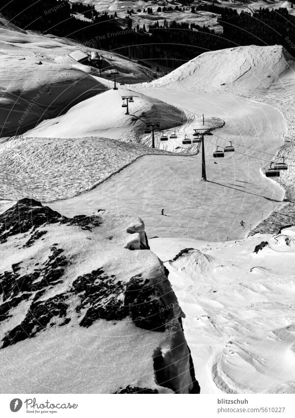 Skiing with plenty of room for turns Snow Mountain Winter Skier skis Cold Sports Landscape Sky Nature Alps activity Alpine vacation Black & white photo Swiss