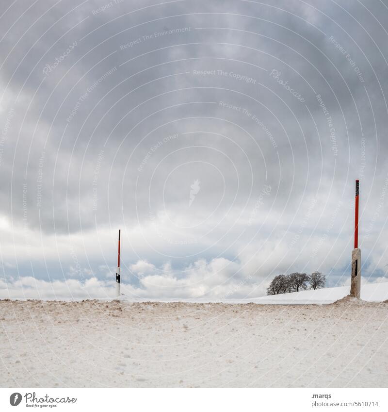 cross section Traffic infrastructure Transport Pole Roadside Road traffic Reflector post Winter Cold Snow Deep Deep snow Country road Horizon Clouds Moody