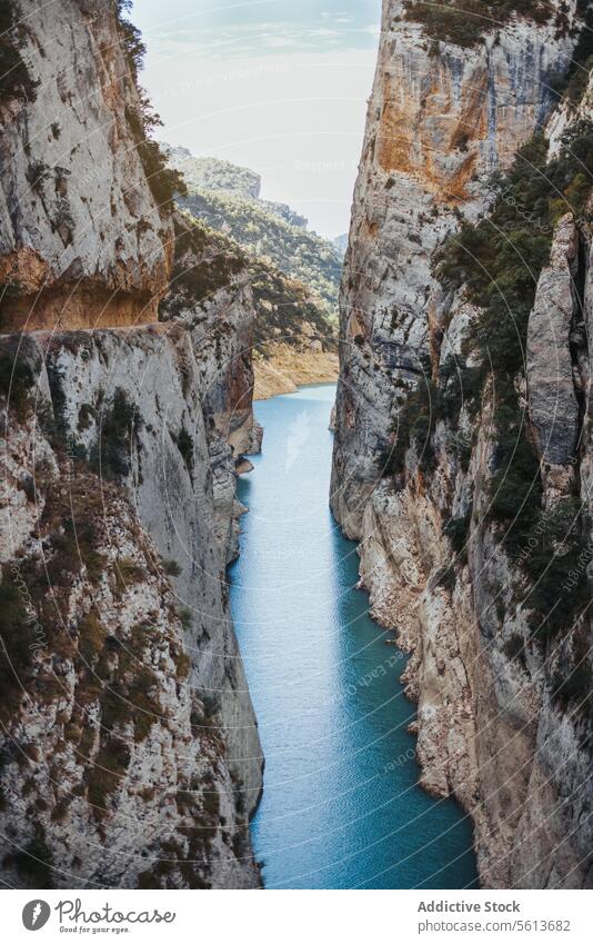 Breathtaking view of majestic mountains with blue river nature rocky water flow picturesque scenery calm narrow rough cliff breathtaking sky scenic spectacular