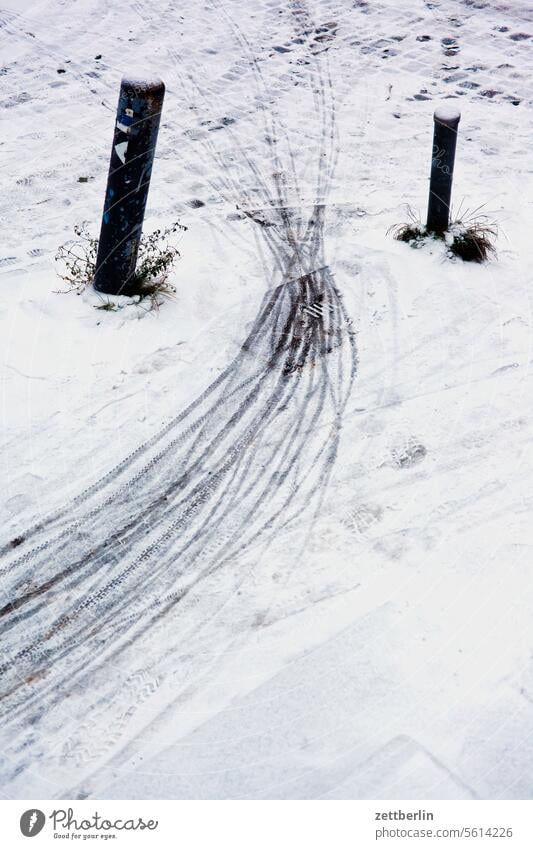 Tracks in the snow Frost snowed Cold Virgin snow cycle path Snow Snow layer trace off Winter winter holidays Sidewalk Bollard Street curb Road traffic Commute