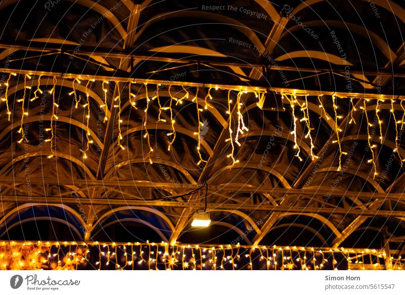 Fairy lights illuminate the roof of a stage at night christmas ornaments Stage stage roof Christmas decoration Christmas & Advent Illuminate Commercialization