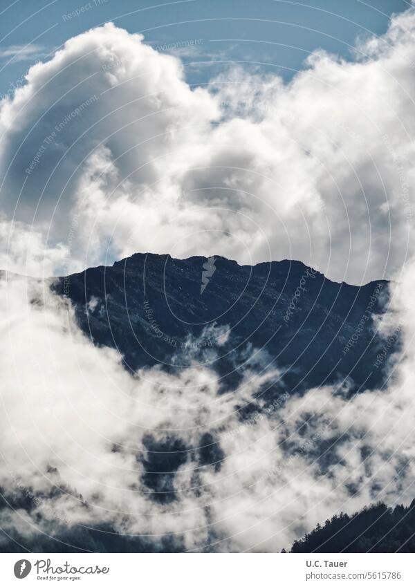 Mountain in South Tyrol with dramatic cloud formations Sky Clouds Gray Dramatic atmospheric mountain Impressive Vacation & Travel majestic table Hiking Weather