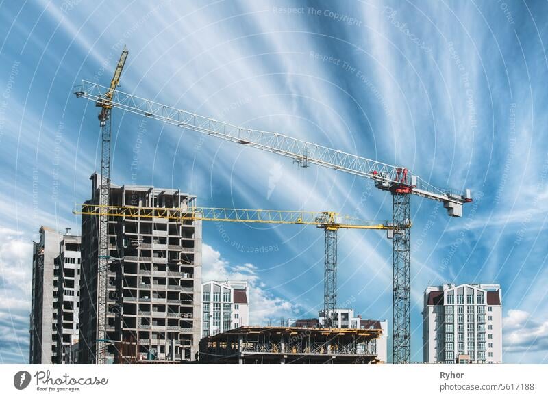 Amazing Bright Blue Sky Above Construction Crane. Construction And Development Of New Multi-storey Residential. Conception Of Development. New Accommodation