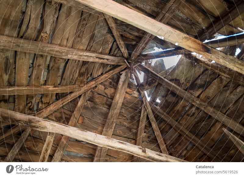 Old, destroyed roof truss made of chestnut beams, stone slabs still partially cover it. Roof Architecture House (Residential Structure) Building