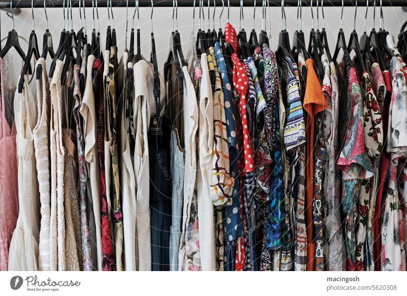 Vintage clothes on a clothes rail in a second-hand store Second-hand shop Fashion Clothing Colour photo Flea market Retro Shopping Sell second hand Deserted