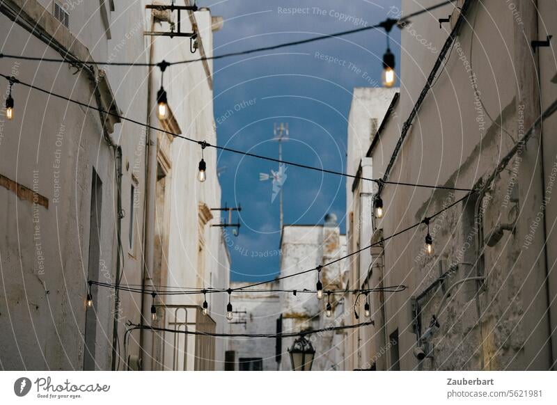 Street lighting above the road between medieval houses in Ostuni Streetlight Sky Medieval times Apulia Zigzag picturesque Town Light Lighting Lantern Lamp