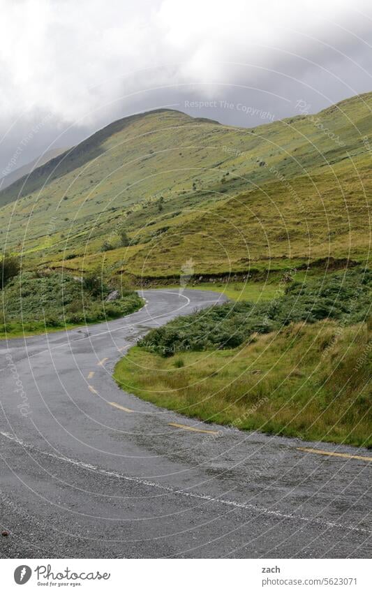 left/right Ireland Green Hill Grass Landscape Mountain Meadow Nature Street Lanes & trails Curve Clouds