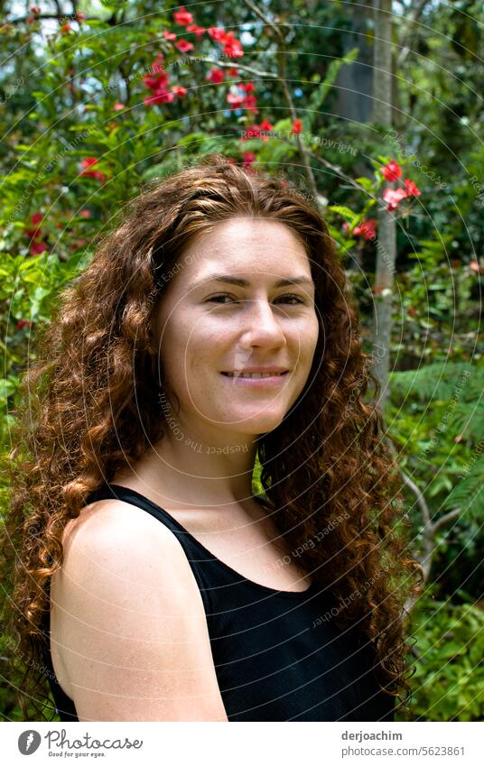 Young girl with enchanting curls stands in front of a rainforest. girls Woman pretty Colour photo Human being portrait Multicoloured Youth (Young adults)