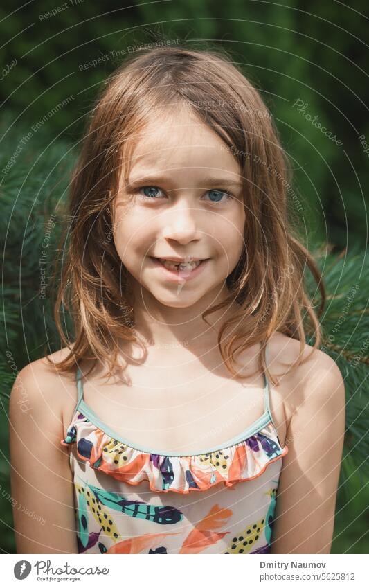 Portrait of a girl with lost milk teeth Deciduous teeth Looking At Camera baby teeth baby tooth beautiful brunette candid candid portrait caucasian change