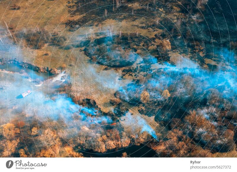 Concept Of Save Nature. Nature In Danger. Wild Open Fire Destroys Grass. Natural Disaster. Aerial View Of Dry Grass Burns During Drought And Hot Weather. Bush Fire And Smoke In Field