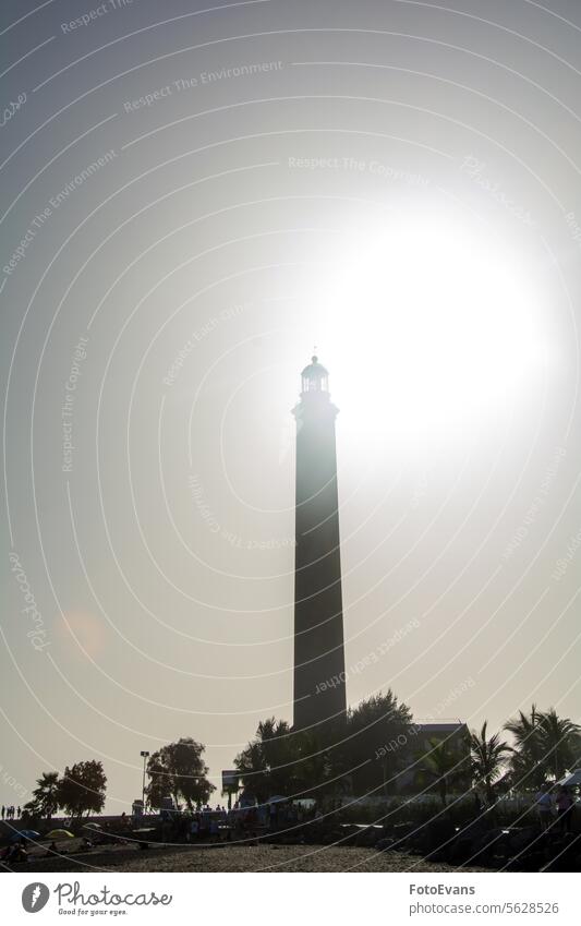 Lighthouse in Maspalomas, Gran Canaria, Spain at sunset sunny Faro de Maspalomas tourist background Canary Island sea Canary Islands beach outside island