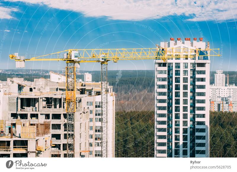 Amazing Bright Blue Sky Above Construction Crane. New Accommodation Concept. Construction And Development Of New Multi-storey Residential. Conception Of Development