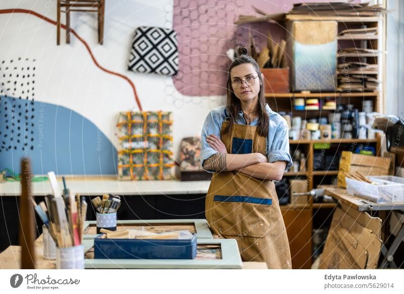 Portrait of a confident female carpenter standing in her workshop Furniture Carpenter Restoring Carpentry wood Chair building Manufacturing Craft Renovation