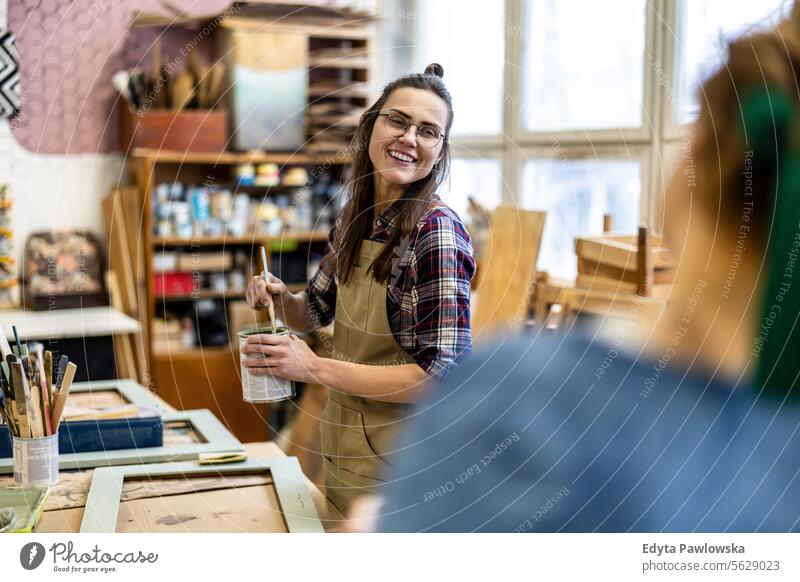 Female carpenter working in her workshop Furniture Carpenter Restoring Carpentry wood Chair building Manufacturing Craft Renovation Repairing Craftsperson