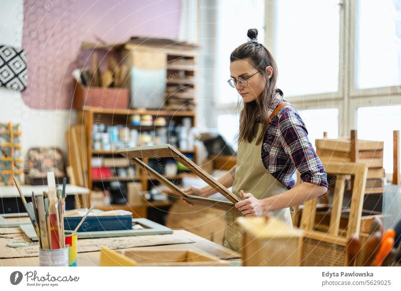 Female carpenter working in her workshop Furniture Carpenter Restoring Carpentry wood Chair building Manufacturing Craft Renovation Repairing Craftsperson