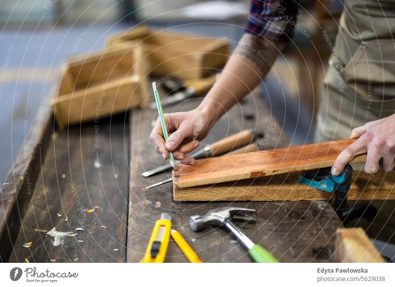 Female carpenter working in her workshop Furniture Carpenter Restoring Carpentry wood Chair building Manufacturing Craft Renovation Repairing Craftsperson