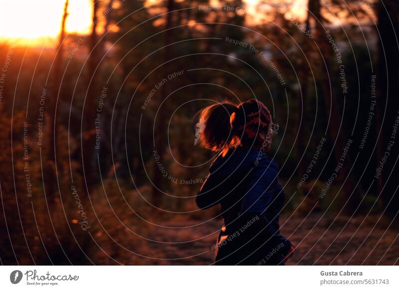 Woman runs up the mountain at sunrise. Mountain Sunrise Exterior shot Landscape Colour photo Morning Sunbeam Nature Back-light Light Tree Dawn