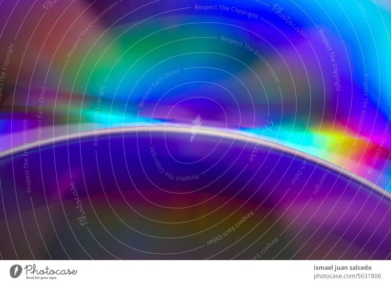 colorful neon lights in the compat disc rays rays of light laser colors blue blue background blue color bokeh design art gradient digital technology cd