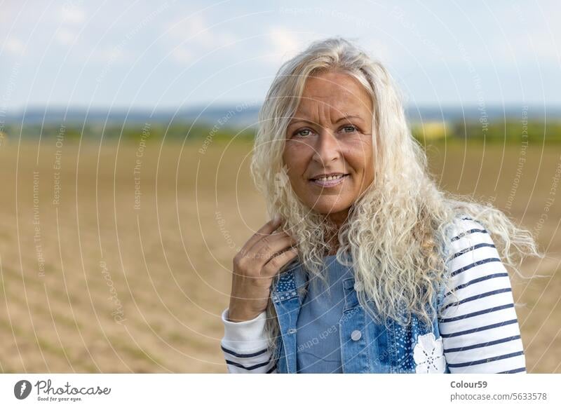 Happy adult Woman caucasian retirement one cheerful looking camera standing laughing satisfied best ager expression pensioner emotion enjoy beautiful middle age