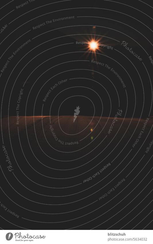 Sunrise on a mountain peak with freshly groomed slopes Back-light Morning Light Nature Dawn Landscape Beautiful weather Sunbeam Sky Calm Idyll Environment