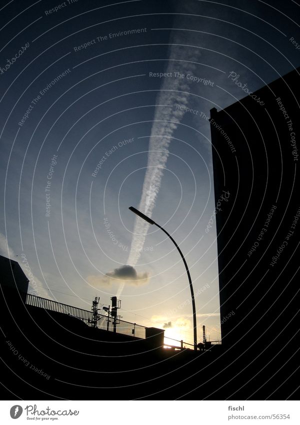 Between the concrete Evening sun Low-key Silhouette Vapor trail Clouds Lantern Concrete Illustration Dusk Nature and technology Town