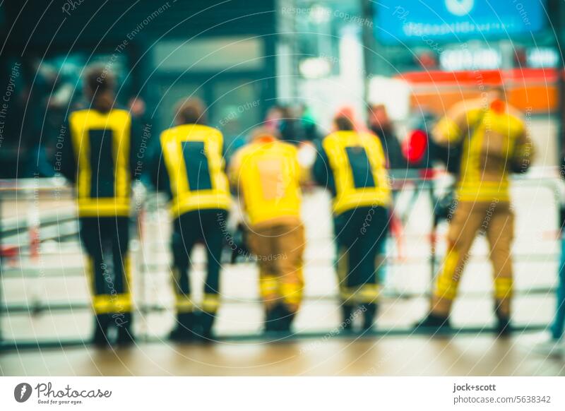 also blurred to recognize warning vest of the fire department high-visibility vest Fire department blurriness Safety Work and employment Side by side group Help