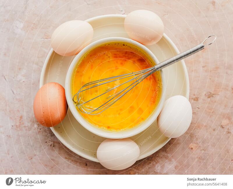 Raw scrambled eggs in a bowl. Top view. Scrambled eggs Breakfast Preparation Food Fresh Egg Cooking Table Ingredients Colour photo Food photograph Eating