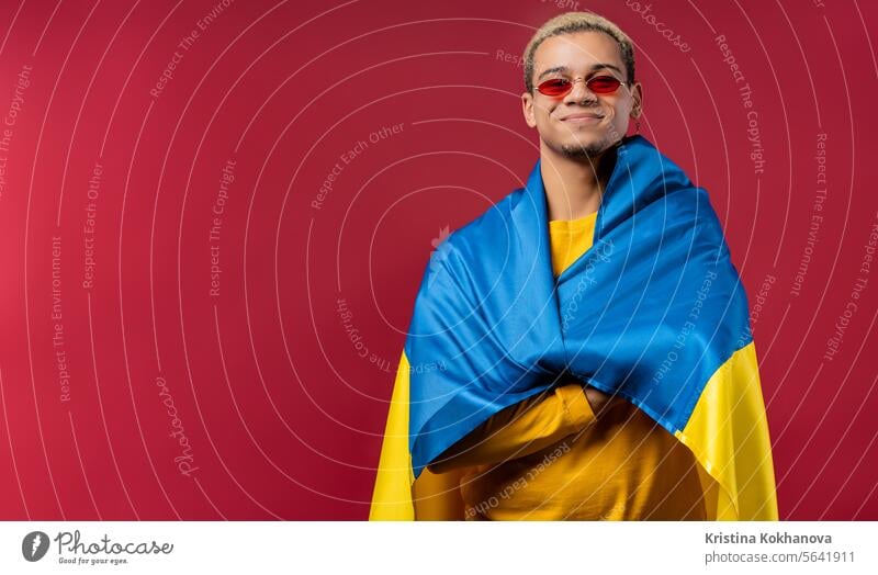 Superman with national Ukrainian flag. Ukraine, patriot, victory war celebration banner beautiful celebrating cheerful clever culture curly haired east europe