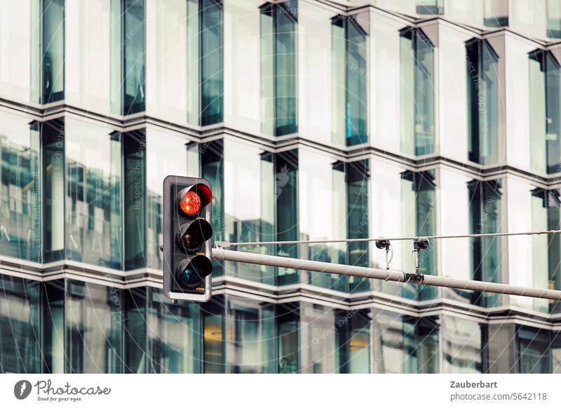 Traffic light shows red, in front of a modern façade with glass and jagged lines Red Facade Modern Glass serrated Zigzag Carrier Transport Road traffic stop