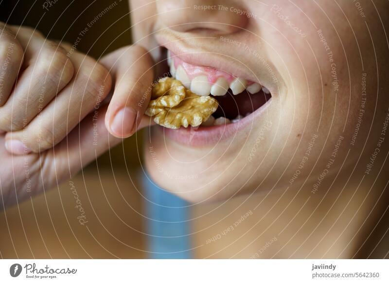 Crop unrecognizable teenage girl eating healthy walnut Girl Walnut Eat Healthy Nut Hungry Fresh Kernel Food Nutrition Bite Diet Snack Protein Vitamin Mouth Open