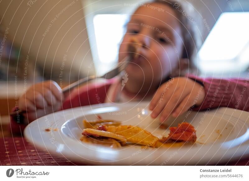 Toddler eating. Eating Food Food photograph Delicious Nutrition Healthy Eating Colour photo Child Red Plate Tongue lap lick taste it tastes good Green Lunch