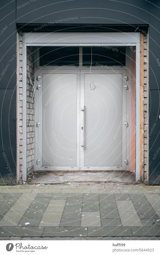 Construction site of an entrance area with new door and loose hanging cables modernise Redecorate Modernization Redevelop Wall (barrier) Wall (building)