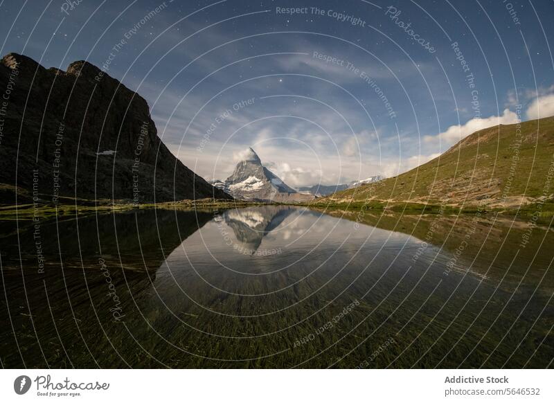 Majestic mountain reflection under starlit sky starry night landscape serene lake water calm peak majestic nature outdoors scenic beauty tranquil wilderness