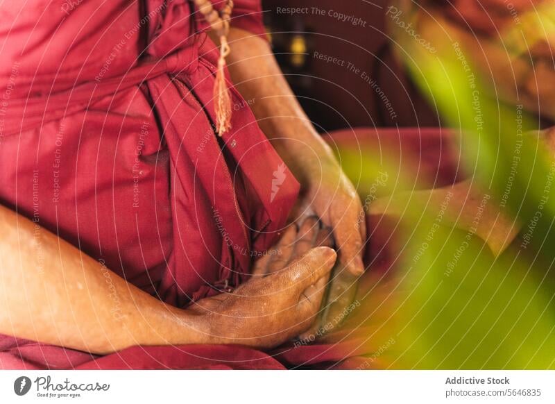 Crop senior woman in traditional robe at prayer time in Thailand meditate religion harmony buddhist buddhism lotus pose temple zen oriental female thailand asia