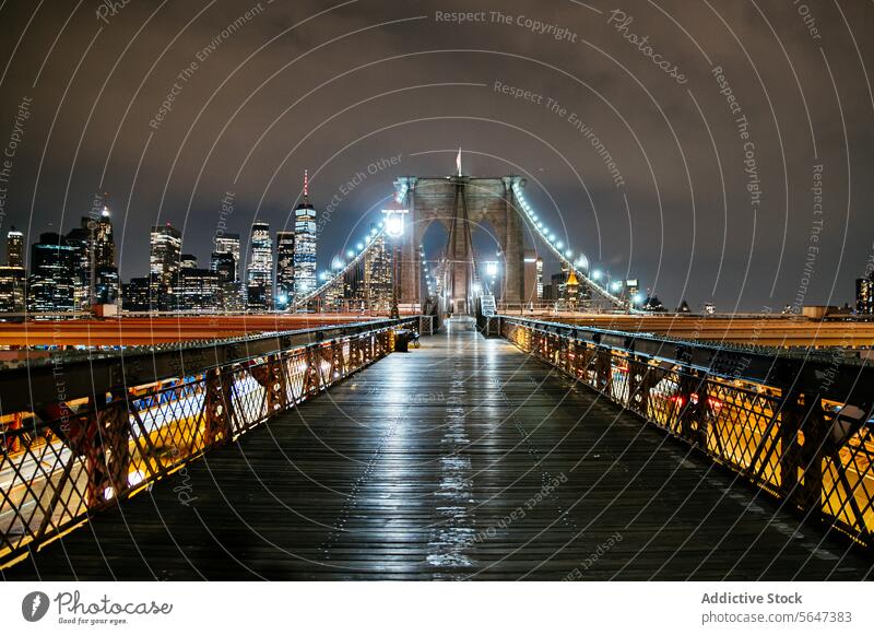 Brooklyn Bridge with Manhattan skyline at night. brooklyn bridge manhattan city lights architecture landmark river water urban travel tourist destination