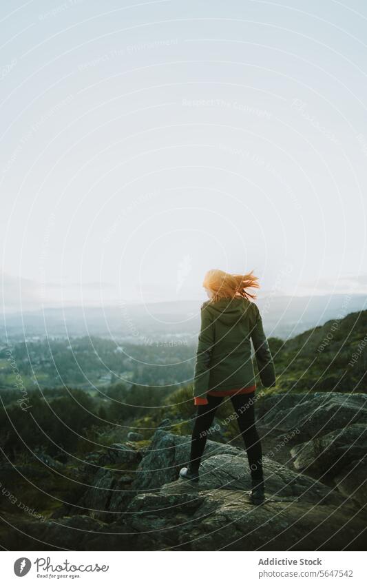 Explorer on Vancouver Island Overlooking Scenic Vista vancouver island canada british columbia adventurer woman rocky outcrop overlook scenic vista landscape