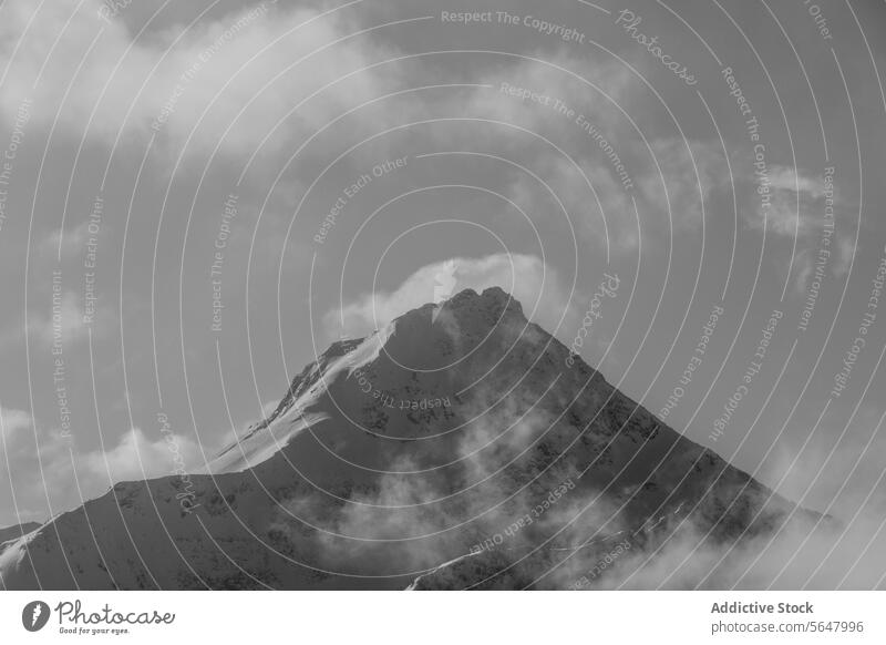 Idyllic view of snowcapped mountain under sky peak scenic beautiful majestic rocky covering top cloudy sunny canada low angle highland altitude geology scenery