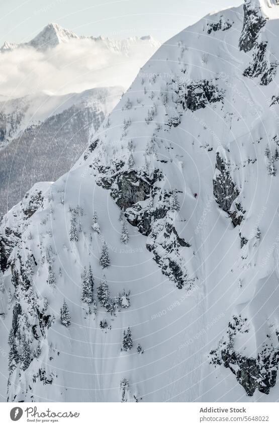 Scenic view of snow covered mountains snowcapped range scenic cloudy sky winter canada picturesque idyllic tranquil nature majestic massive covering geology