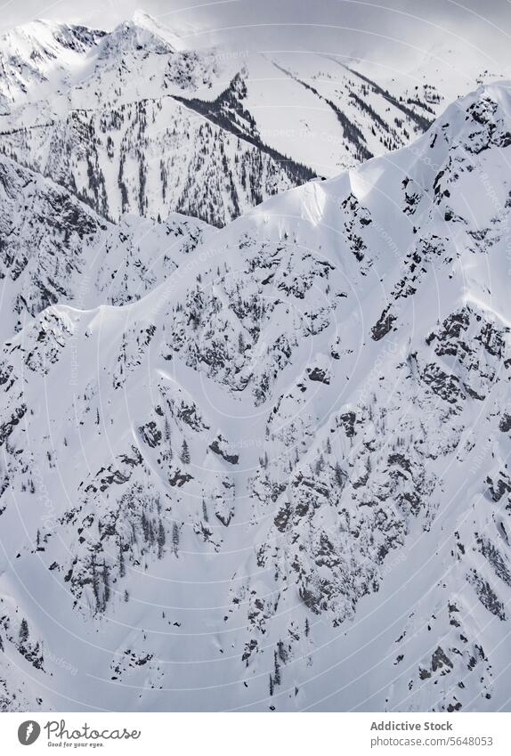 Scenic view of snow covered mountains snowcapped range scenic cloudy sky winter canada picturesque idyllic tranquil nature majestic massive covering geology