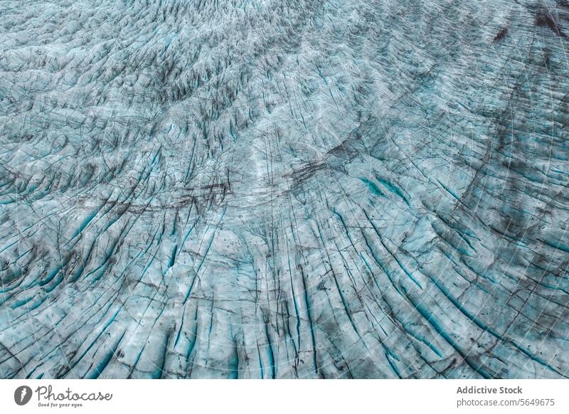 Top view close up of textured dry surface of massive Vatnajokull glacier with cracks in Iceland on winter day ice snow landscape nature formation volcanic