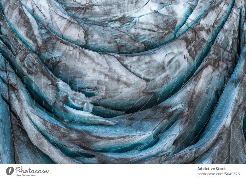 Top view close up of textured dry surface of massive Vatnajokull glacier with cracks in Iceland on winter day ice snow landscape nature formation volcanic