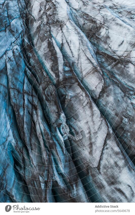 Top view close up of textured dry surface of massive Vatnajokull glacier with cracks in Iceland on winter day ice snow landscape nature formation volcanic