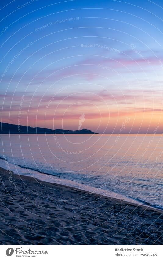 Picturesque view of seascape under blue sky ocean beach water sand picturesque idyllic serene beautiful horizon coast coastline sunset scenic seaside shore land