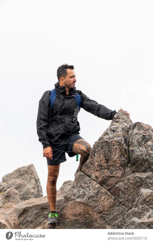 Serious hiker at Ajusco Summit summit rocky backpack Cumbres del Ajusco national park Pico del Águila Mexico City outdoor adventure travel man nature trail peak