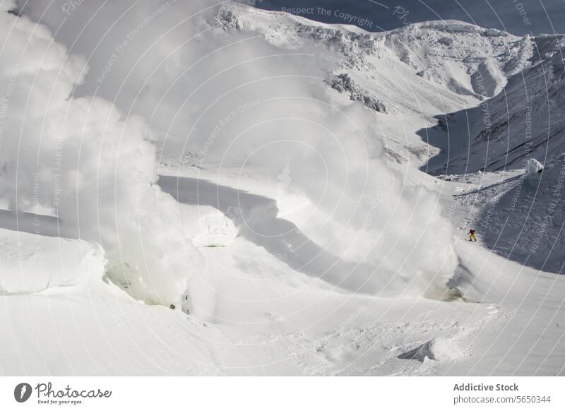 Active skier skiing on snowcapped mountains in Japan person adventure winter japan from above alps volcanic smoke emitting majestic sunlight landscape vacation