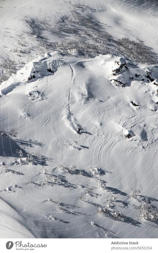 Person riding snowboard idyllic of snowcapped mountains against sky range winter tranquil picturesque majestic sunny japan scenic white massive covering ridge