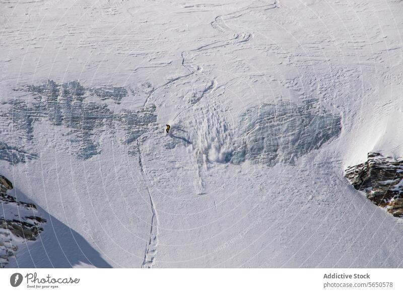 From above of anonymous Snowboarder in action enjoying vacation on snowy mountain in Zermatt Tourist Sport Mountain Slope Vacation Action Adventure Majestic